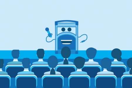 Referral Rock character talking on stage to a group of people
