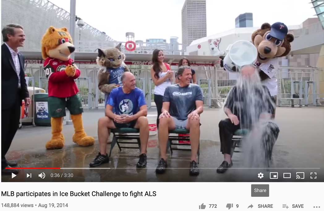 Video still of MLB Baseball players performing the Ice Bucket Challenge, with one person having a bucket of water poured over their head