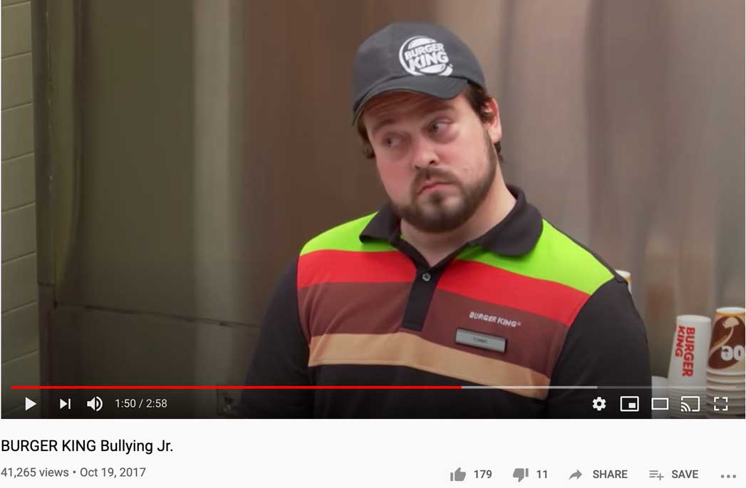 A still from Burger King's "bullying" video, showing a man dressed as a Burger King employee